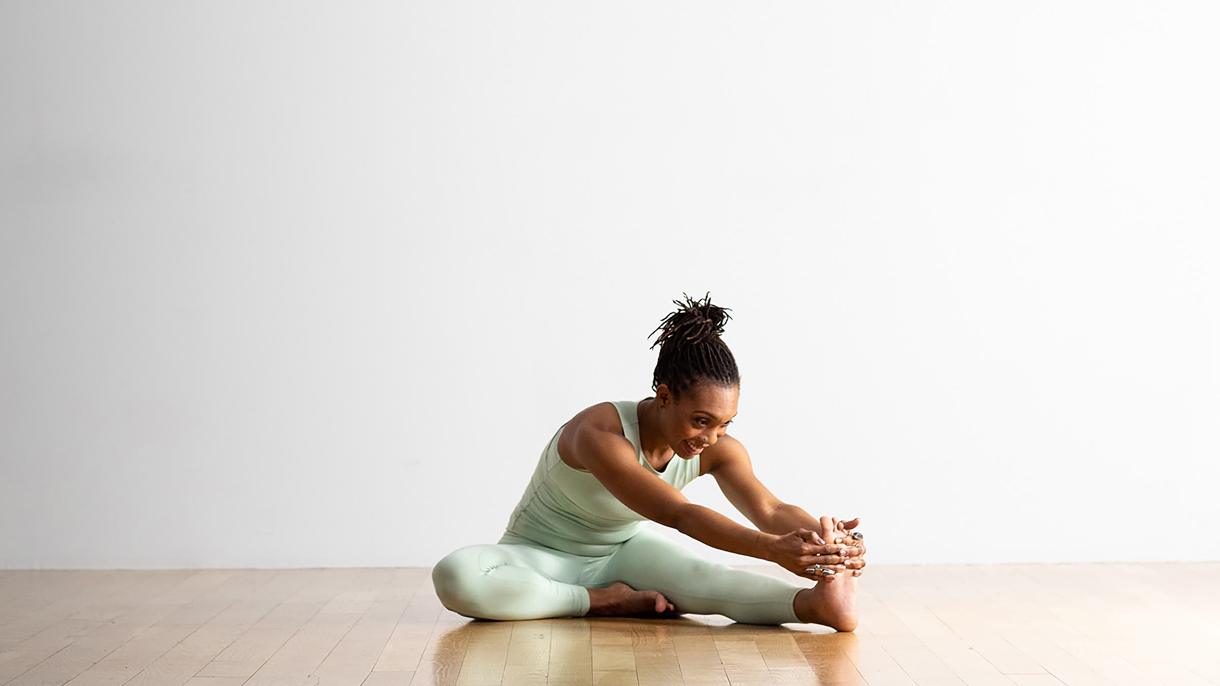 Woman in Head-to-Knee Pose