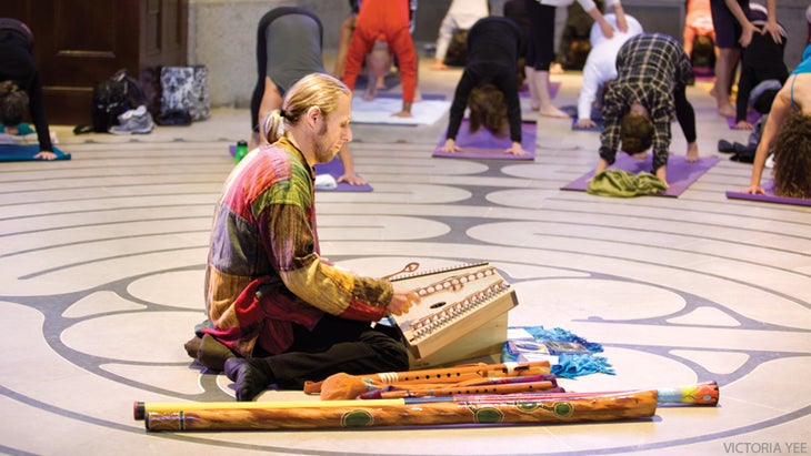 Kirtan man playing for yoga class Kirtan man playing for yoga class