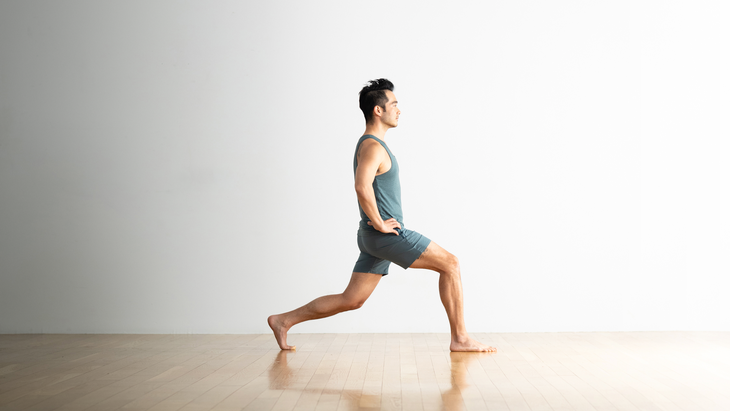 Man practices a variation of High Lunge