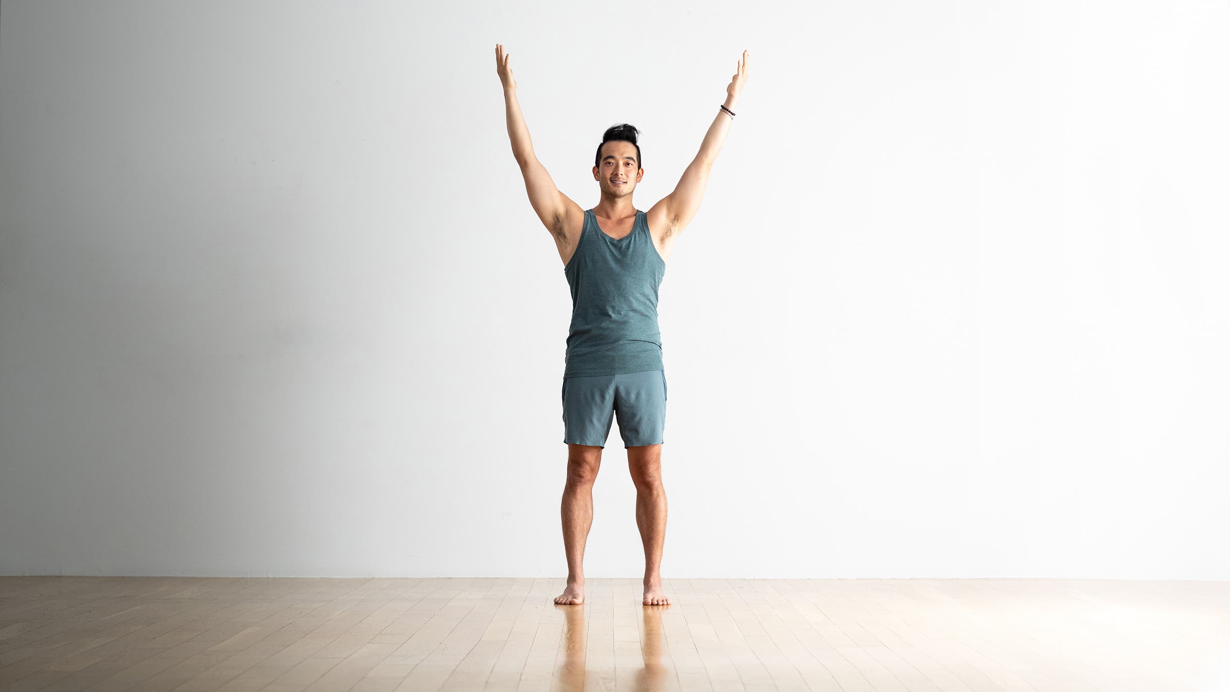 Man doing Upward Salute yoga pose