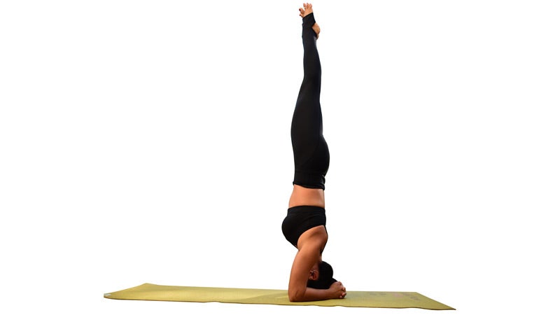 two fit moms perform headstand