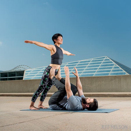 Couple Practicing Acro Yoga High-Res Stock Photo - Getty Images