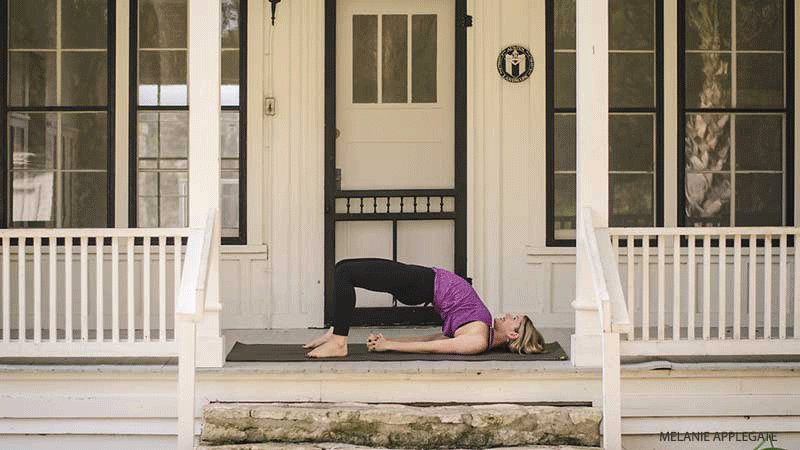 Leah Cullis performs Bridge Pose variations.