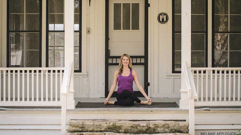Leah Cullis performs Cow Face pose. Leah Cullis performs Cow Face pose.