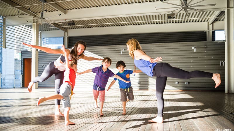 Leah Cullis and friends demonstrate Airplane Pose. Leah Cullis and friends demonstrate Airplane Pose.