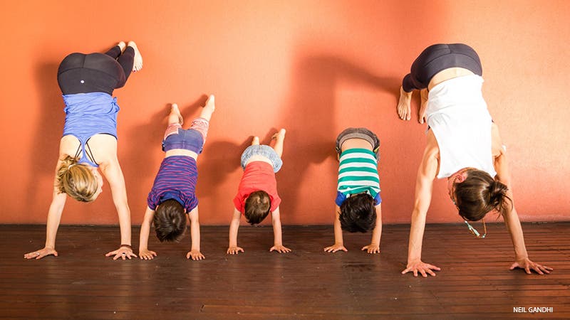 Leah Cullis and friends demonstrate L-shaped Handstand.