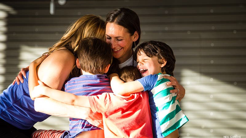 Leah Cullis and friends gather for a group hug.