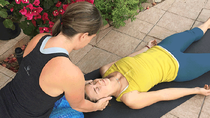 Help Your Students Relax: 5 Hands-On Yoga Adjustments for Savasana