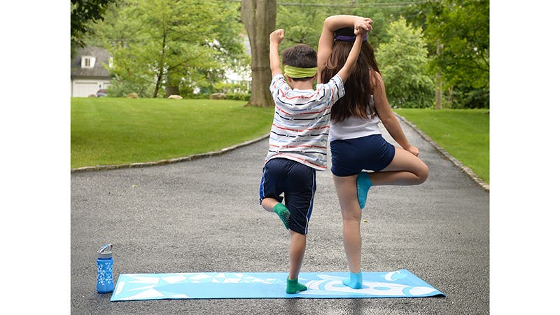 Masumi Goldman's kids doing Tree Pose.