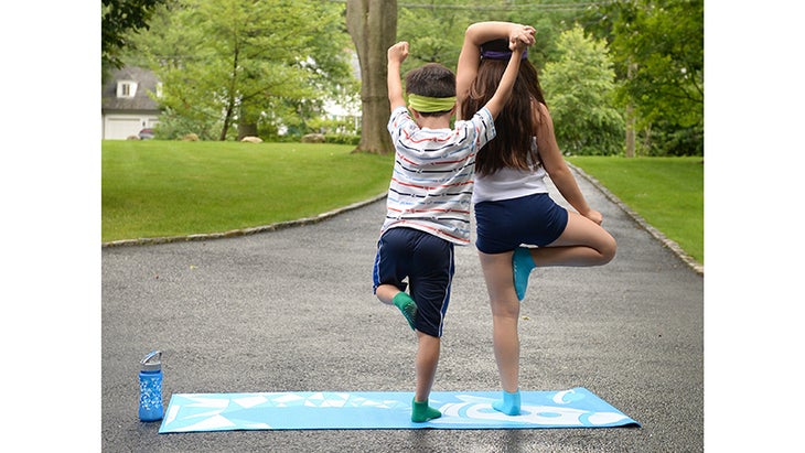 Masumi Goldman's kids doing Tree Pose. Masumi Goldman's kids doing Tree Pose.