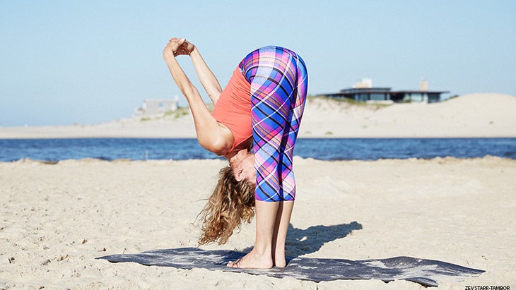 Colleen Saidman Yee performs a Standing Forward Bend. Colleen Saidman Yee performs a Standing Forward Bend.