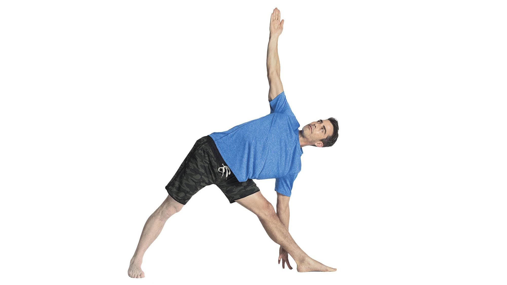 A man performs Utthita Trikonasana (Extended Triangle Pose) in yoga