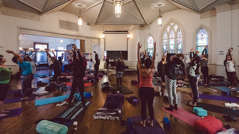 Yogis practice at Amplify and Activate, a series of su