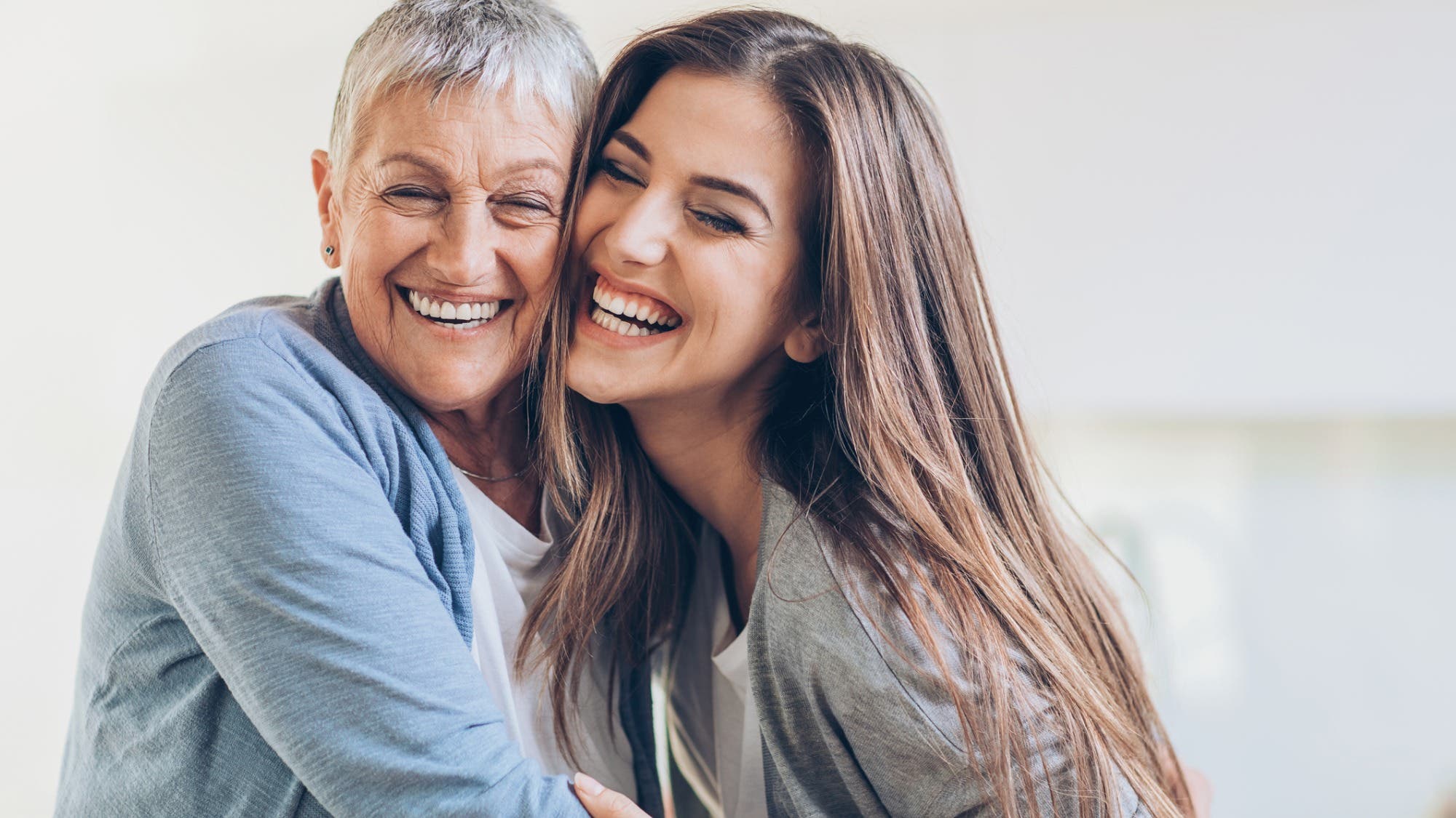 happy-adult-mother-and-daughter-embracing-picture-id658448764 None