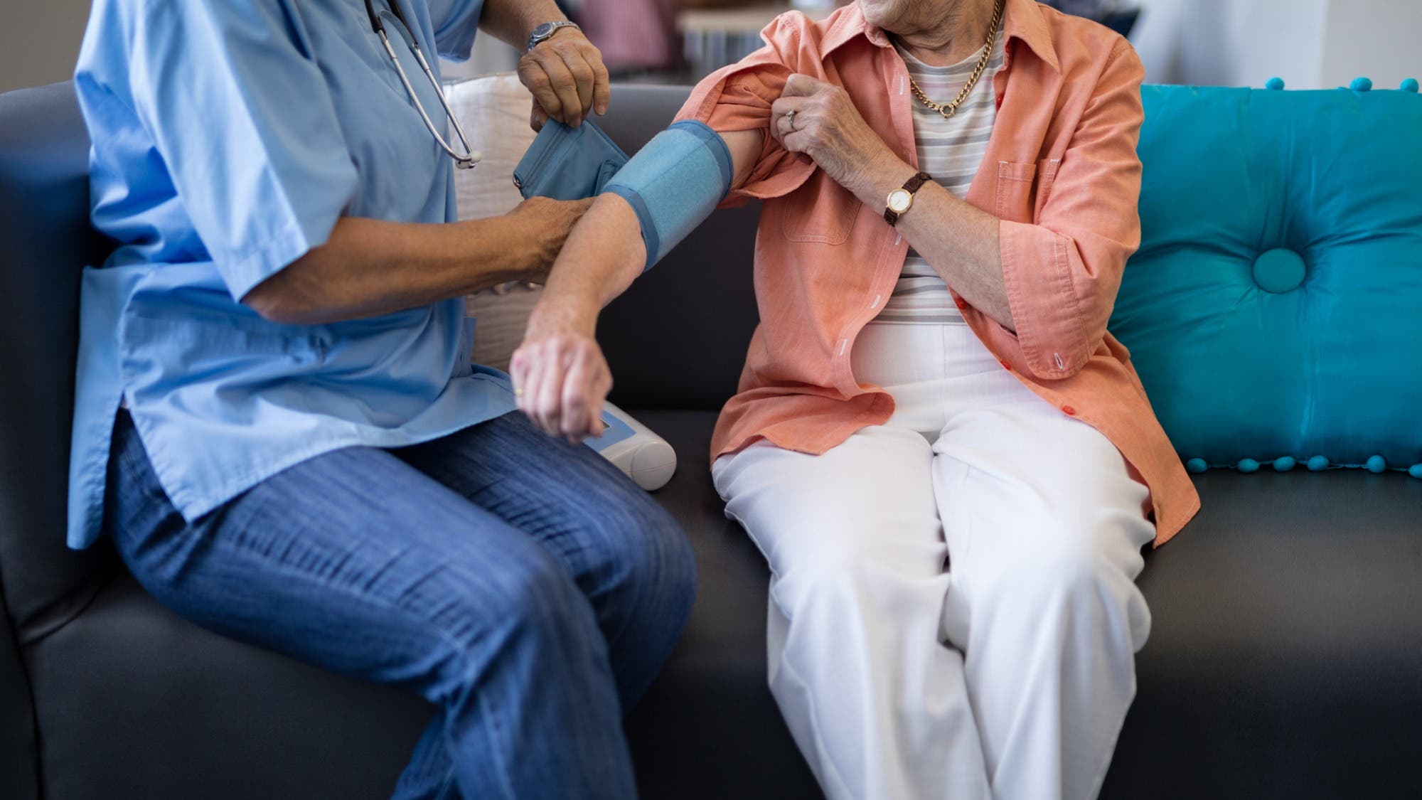 low-section-of-doctor-checking-senior-woman-blood-pressure-picture-id820321886 None