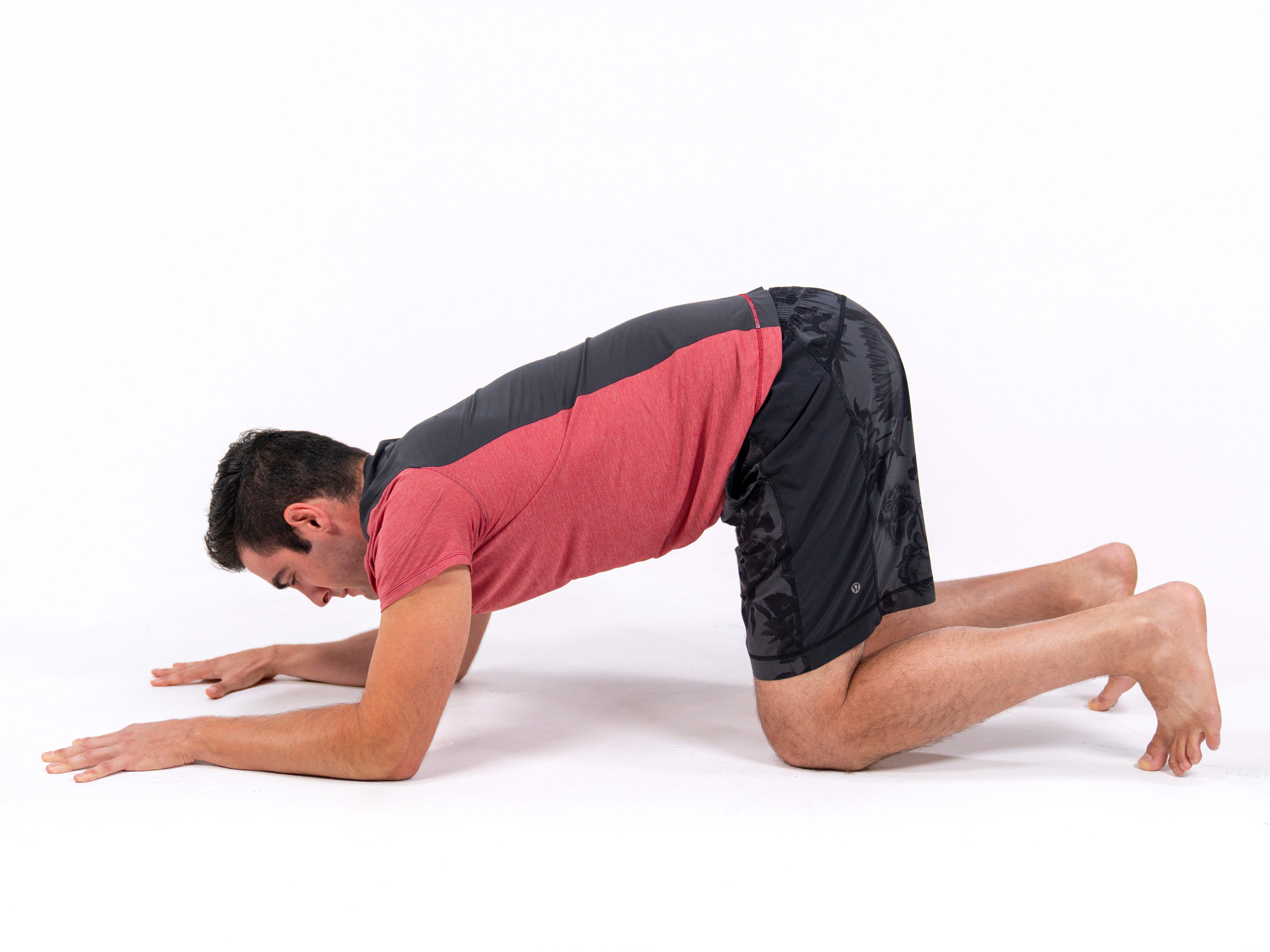 Woman in Pavanamuktasana yoga Pose Stock Photo by ©nanka-photo 87927840