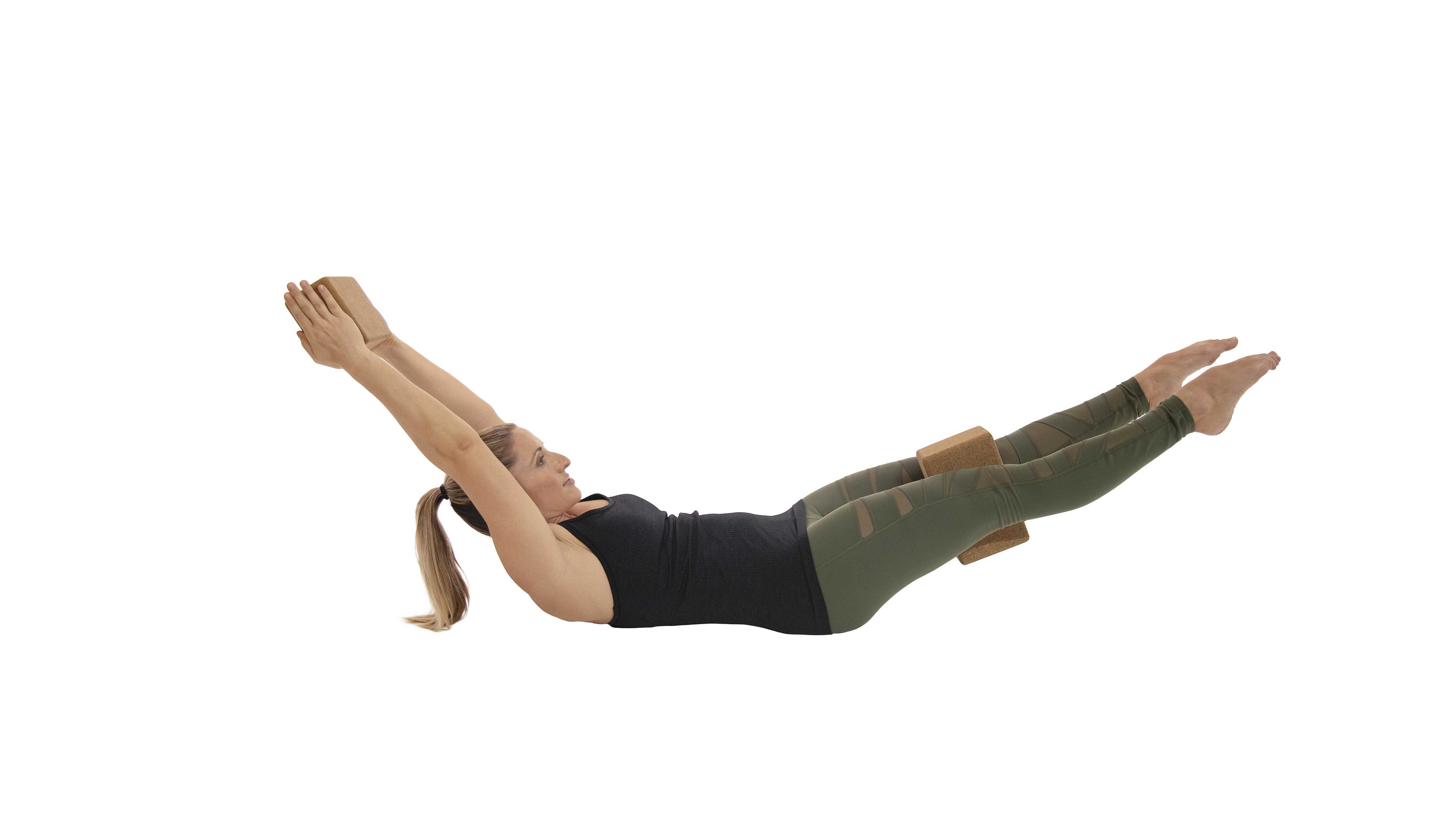 woman practicing hollow body core work
