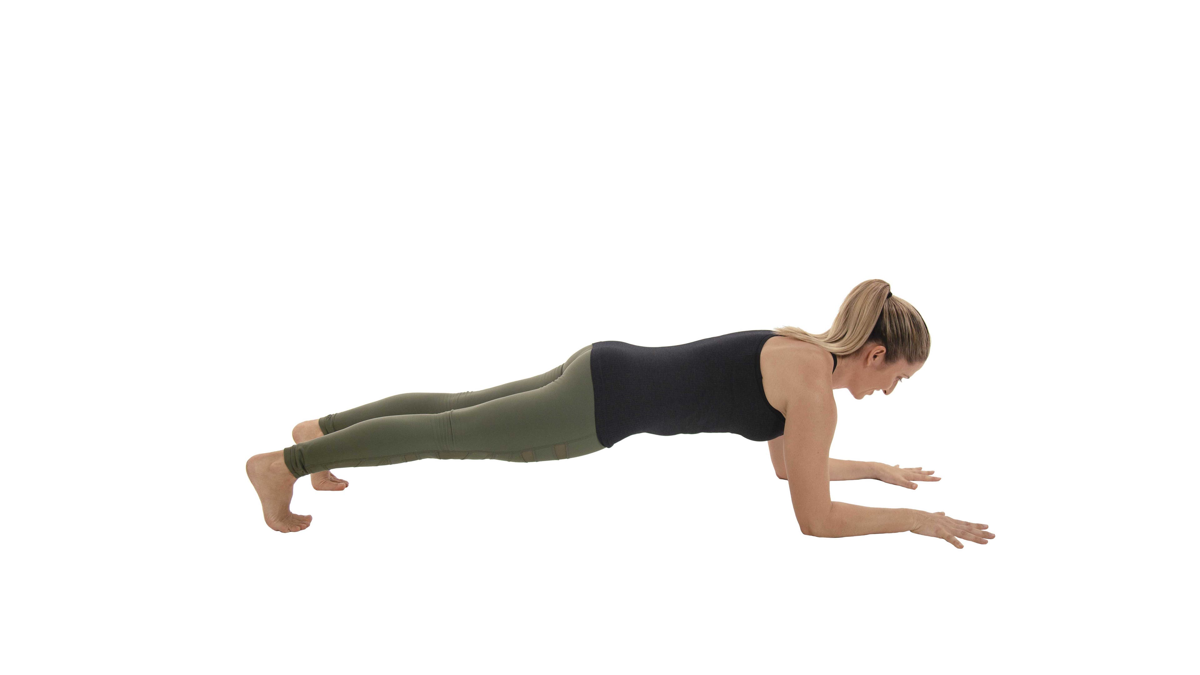 woman practicing plank pose variation
