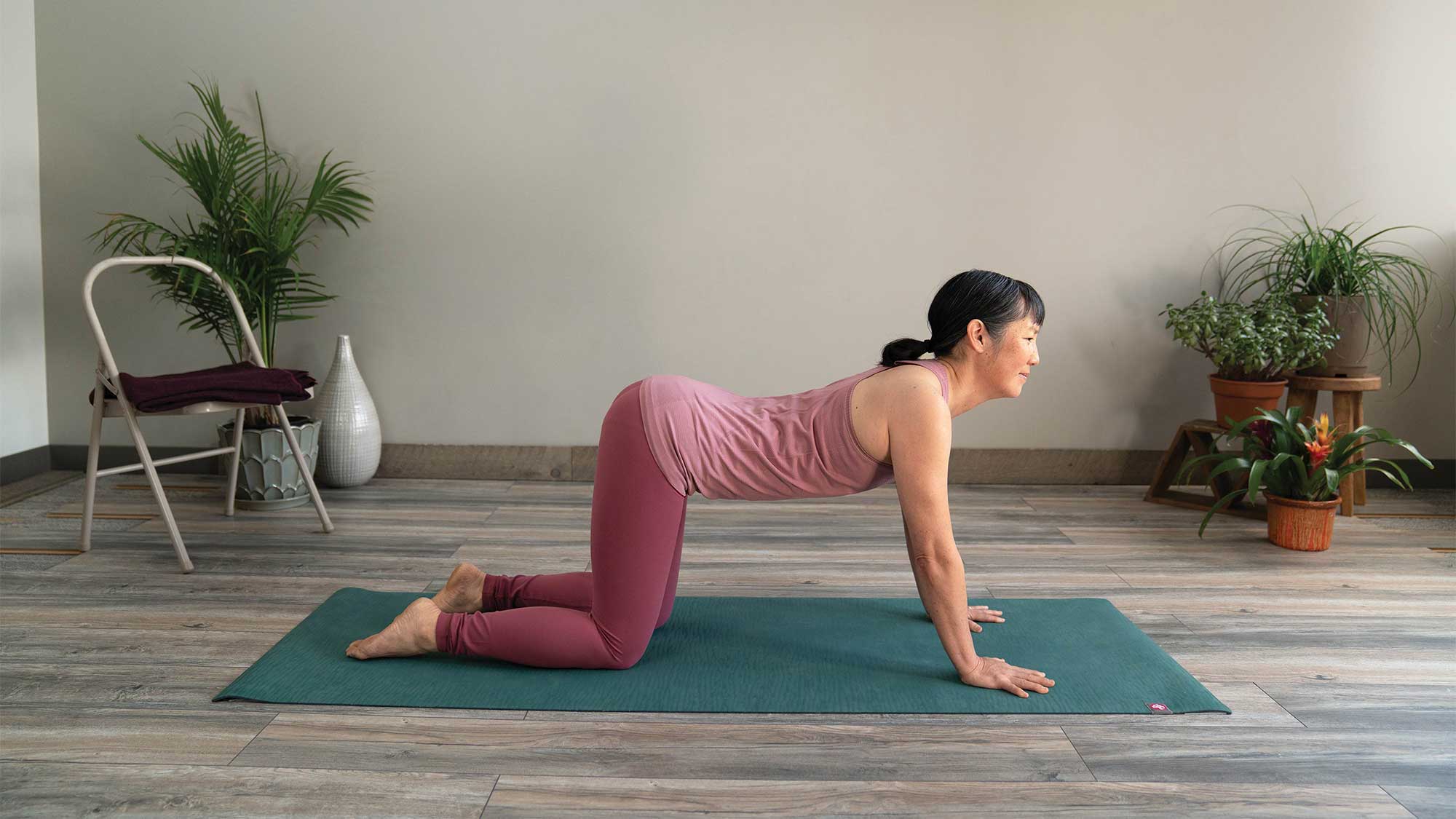 Sarah in her yoga pose, body arched and ready