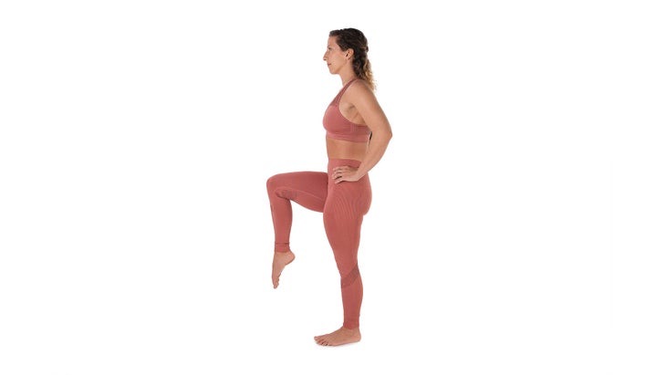 Slim Beautiful Woman Practicing Yoga Asana Standing On One Leg