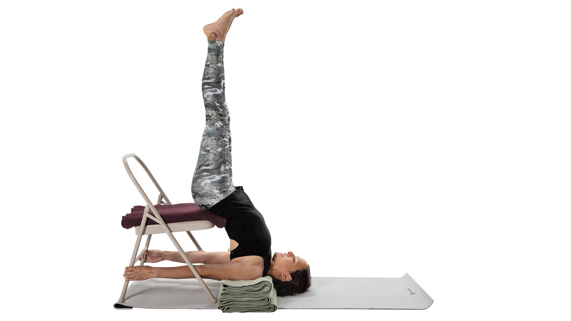 Premium Photo | Flexible woman doing yoga in supported shoulder stand pose  while balancing upside down on mat