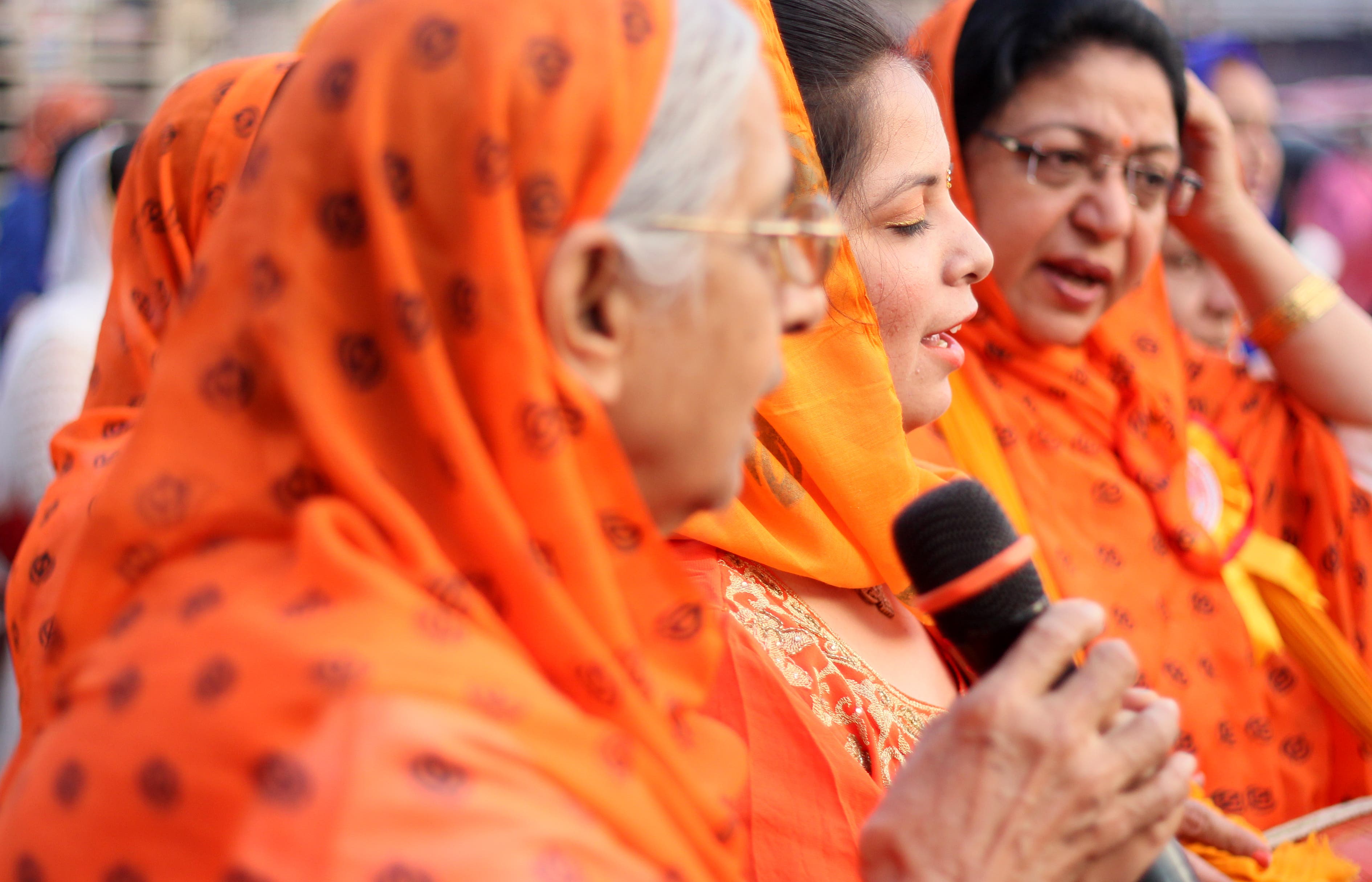 iStock-902946748 Indian women participate in kirtan, or bhajan.