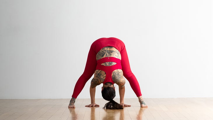 Woman demonstrates Wide-Legged Standing Forward Bend