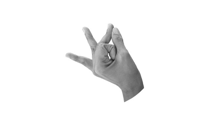 Isolated interlace fingers of both hands and extending up one finger  forming Linga Yoga mudra on white background. Horizontal shot. Stock Photo