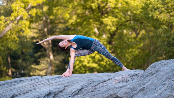 Standing side stretch Yoga pose with a turquoise background, San Diego,  California, USA, North America. - Album alb9165223