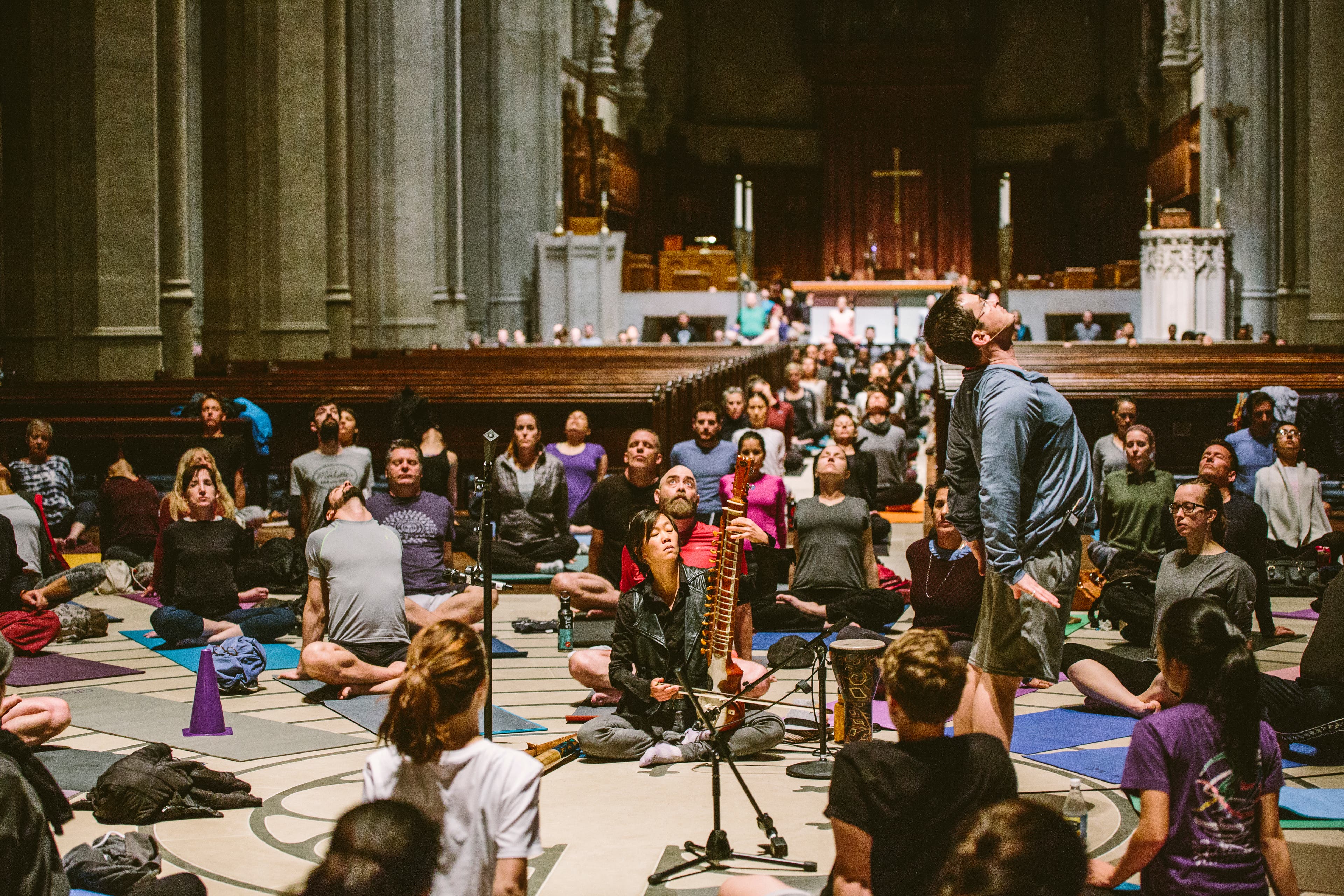 amberfield@gracecathedral_17 A diverse group of students practice yoga at Grace Cathedral