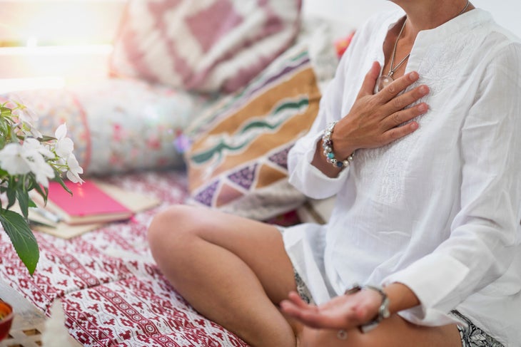 Woman in meditation with mudra
