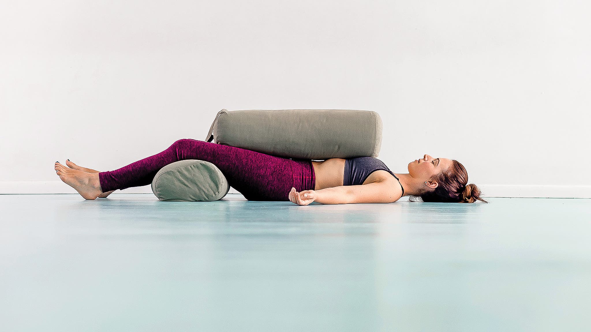 Woman demonstrating Savasana Variation, Corpse Pose