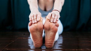 Woman stretches her feet