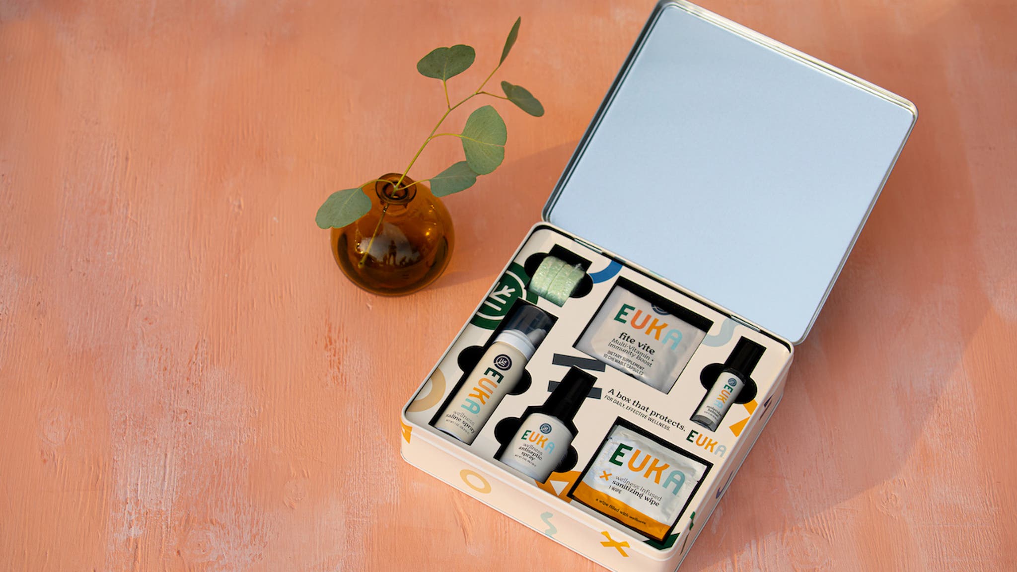 Euka bento box of products on orange background