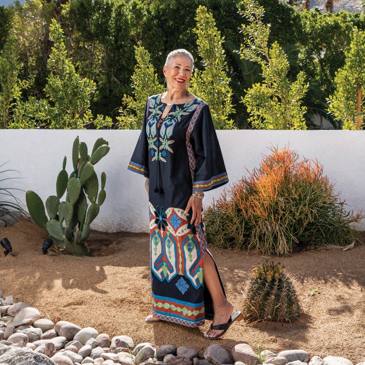 Gail Parker outside in a long dress