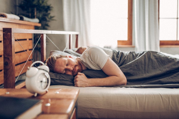 Man sleeping in bed