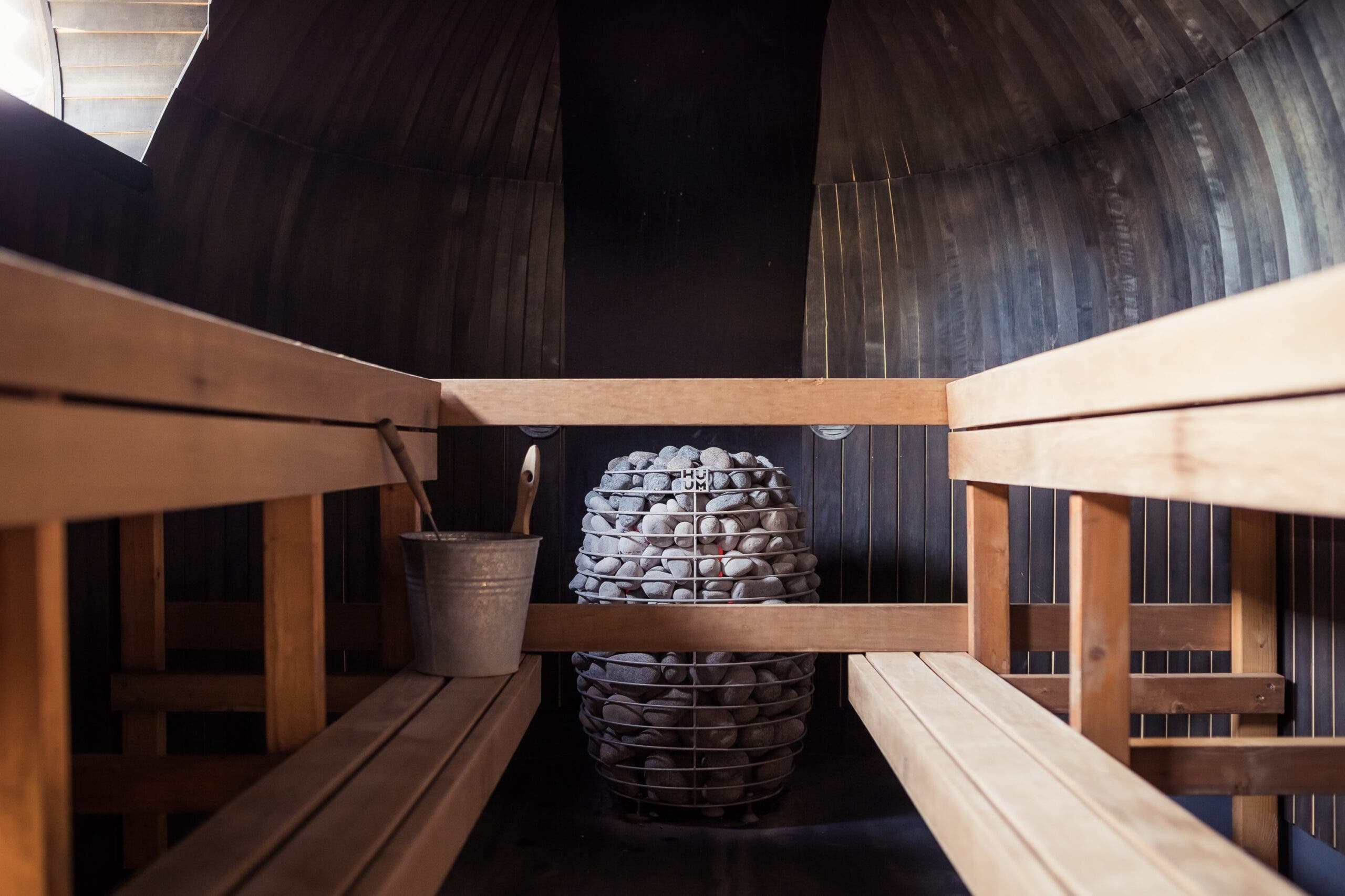 Traditional sauna with benches and rocks