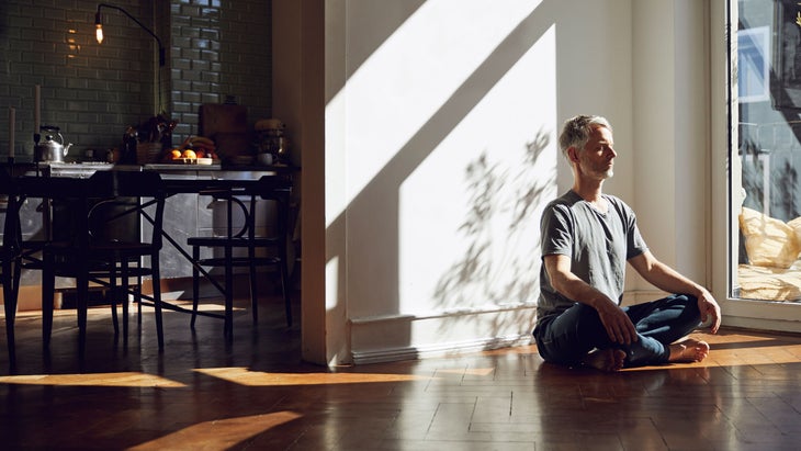 Older man meditates