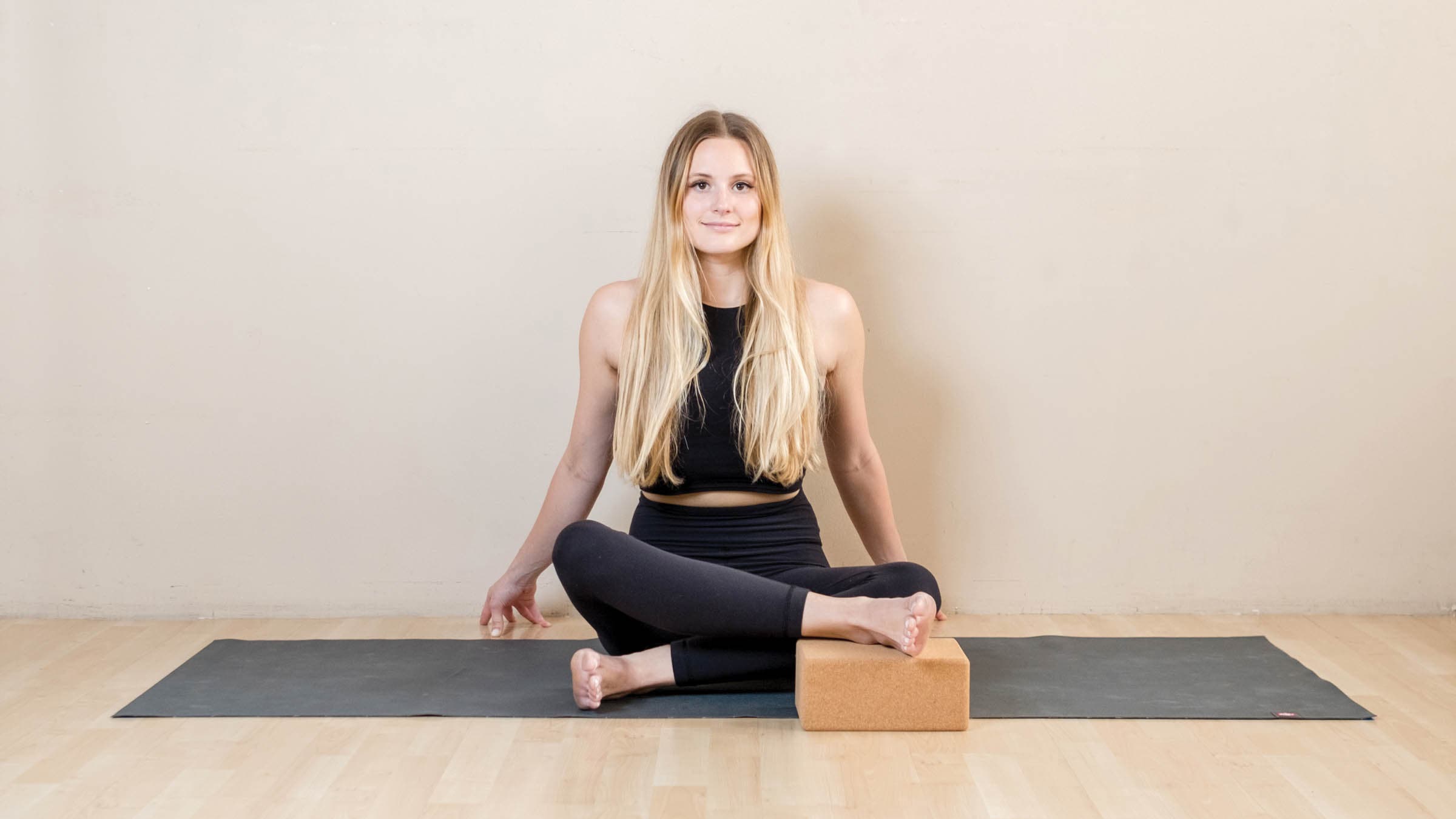 Woman in ankle-to-knee pose