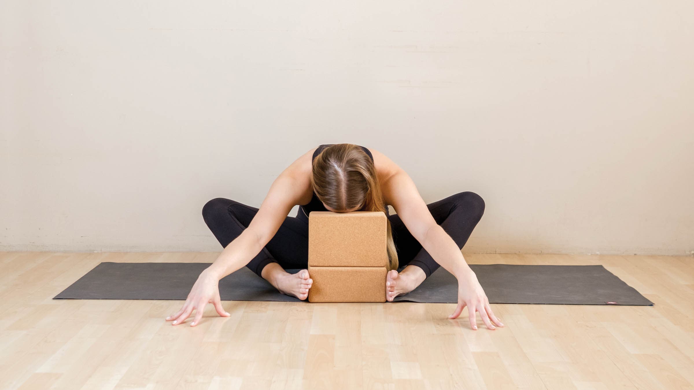 Woman in supported bound angle pose