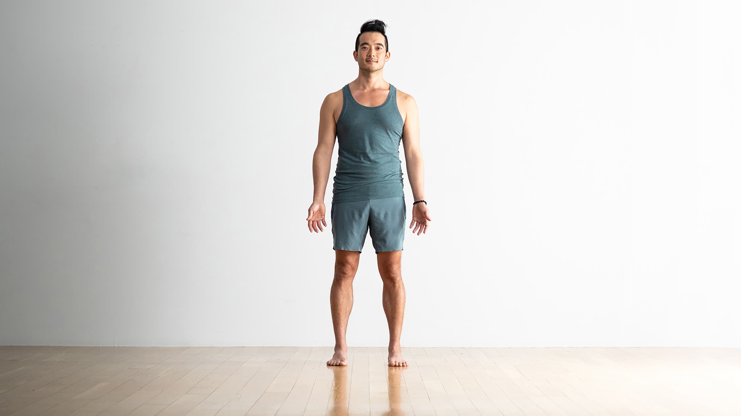 Man in a wide-legged Mountain Pose