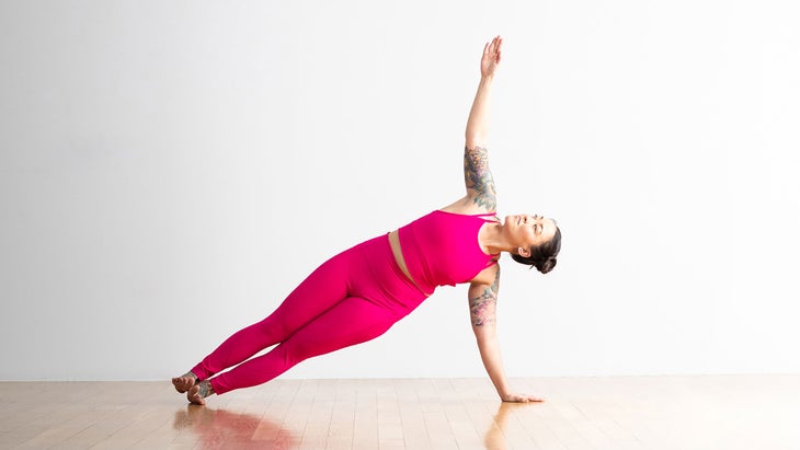 Premium Photo  A woman in a dress is practicing yoga with her eyes closed.