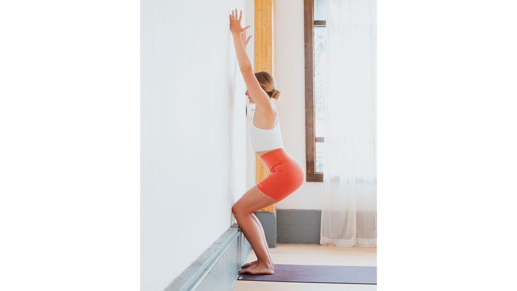 Standing poses with wall support for general level students - Yoga Vastu