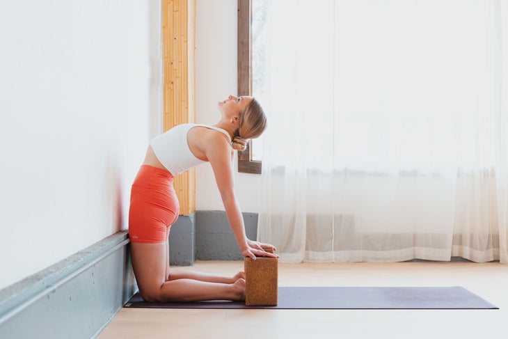 What is a yoga wall? The basics for beginners, equipment, poses & more