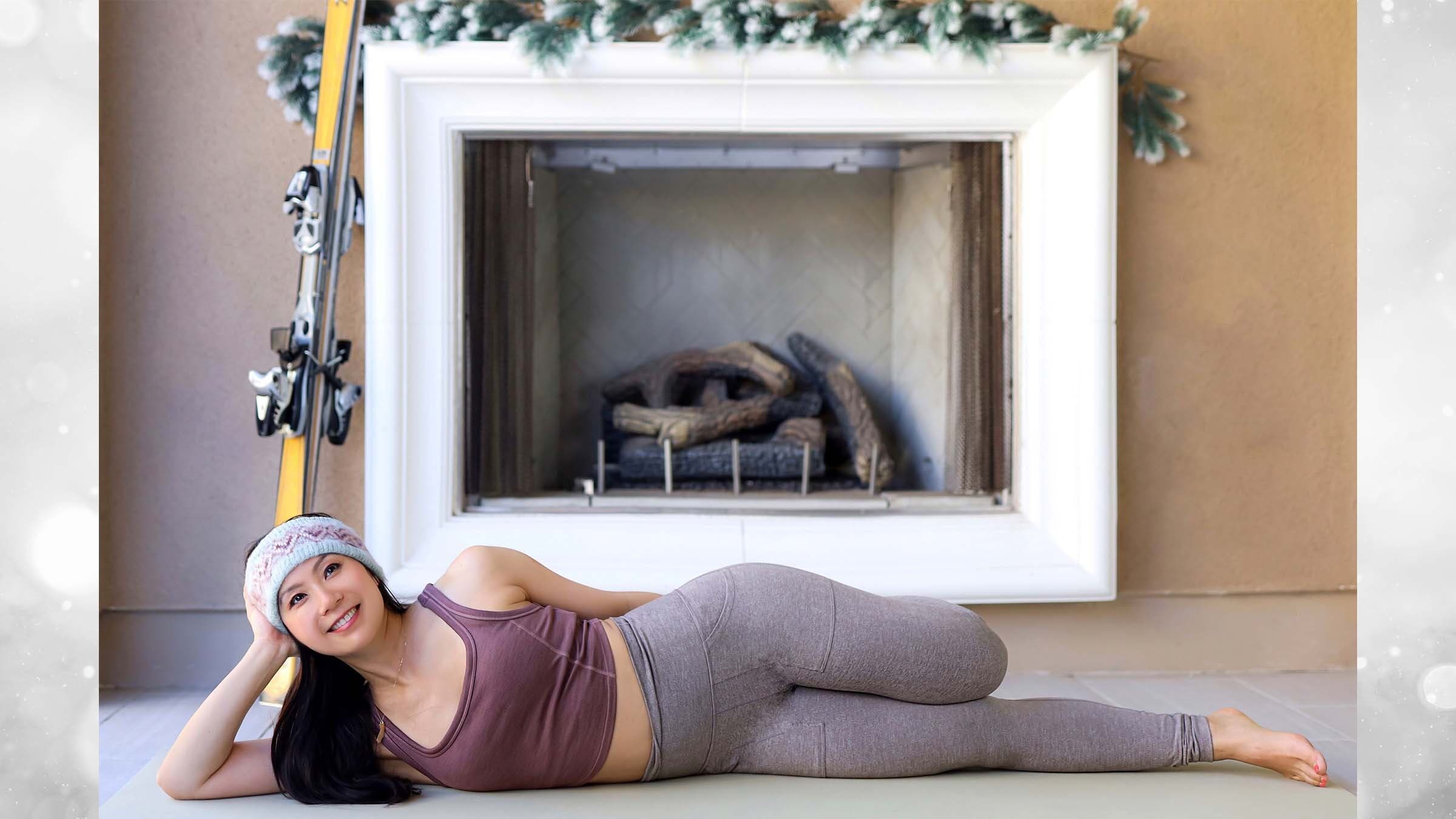Ingrid Yang in Vishu's Couch in front of a fireplace