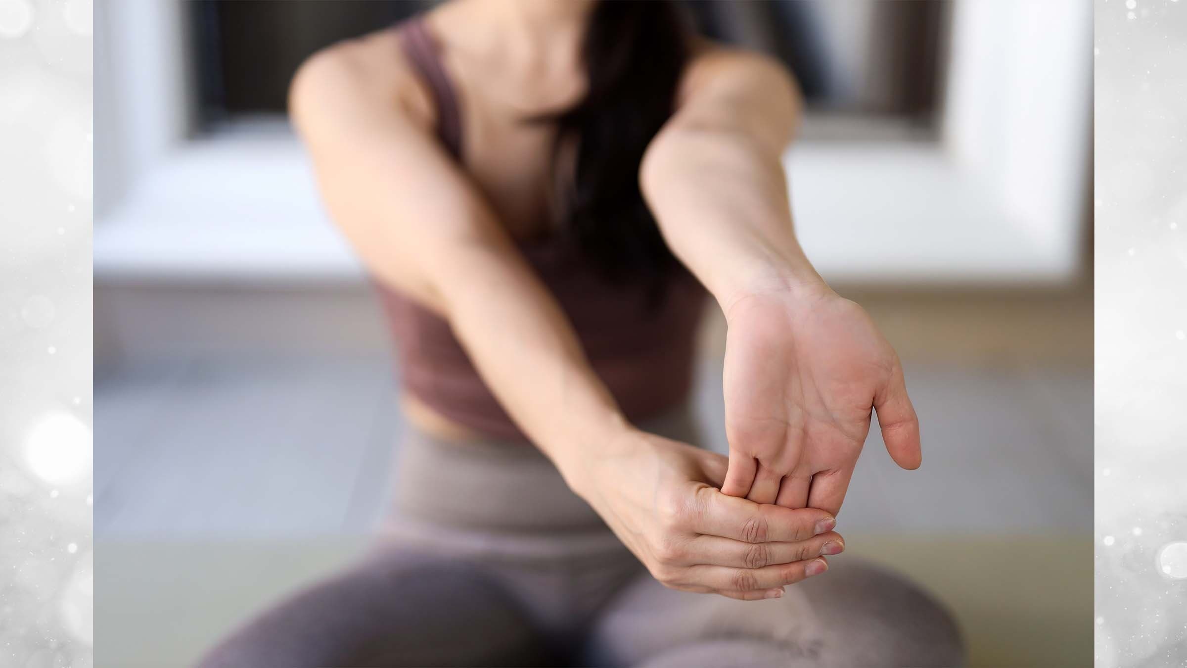 Ingrid Yang wrist stretch close up