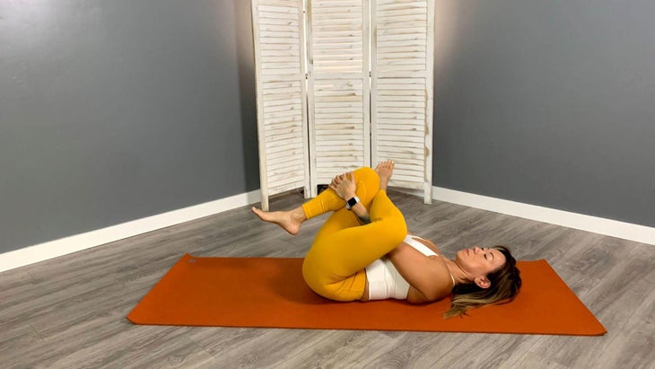 Lisa Jang practices Eye of the Needle Pose