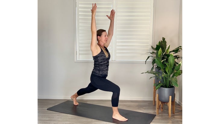 A person demonstrates a High Lunge in yoga