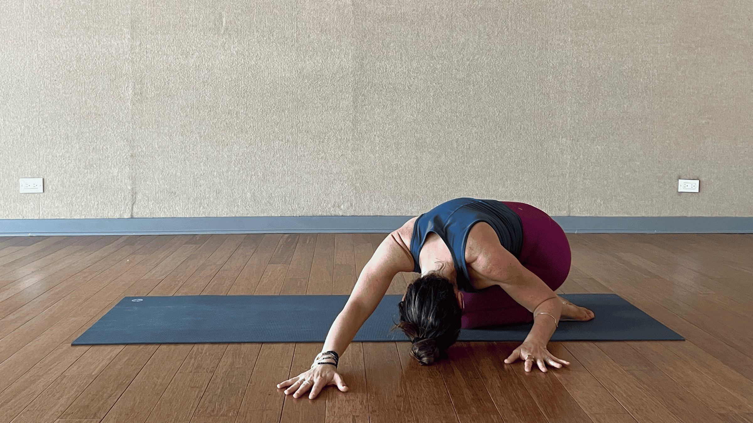 Woman doing side stretch in yogay