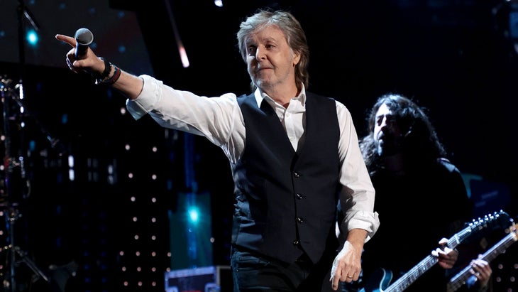 Paul McCartney points to the crowd
